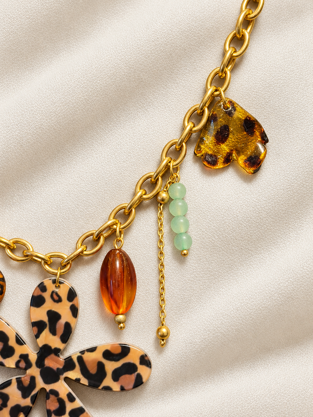 Collier doré à fleur léopard et pampilles