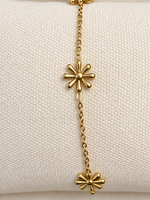 Bracelet doré à trois fleurs rayonnantes