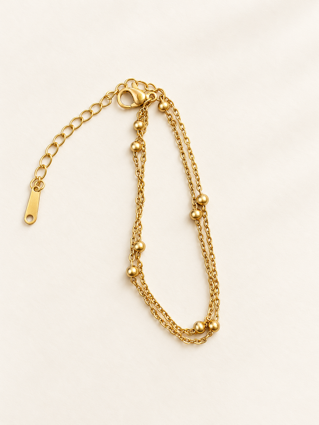 Bracelet doré double chaîne à petites boules